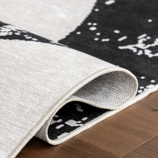 Nuloom Nila SplashGuard Modern Snake Print Machine Washable Area Rug Black